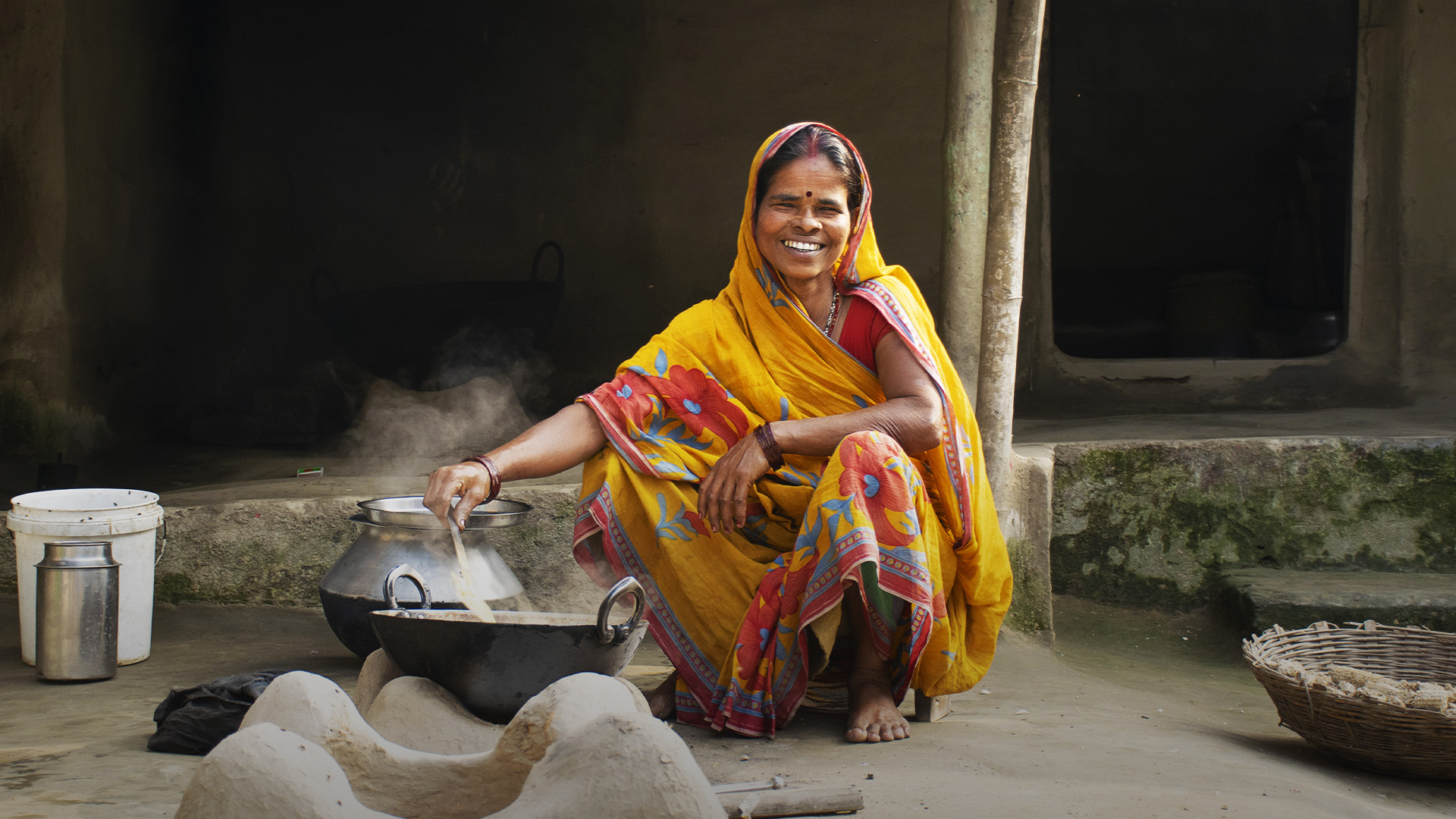 indian woman cooking outside