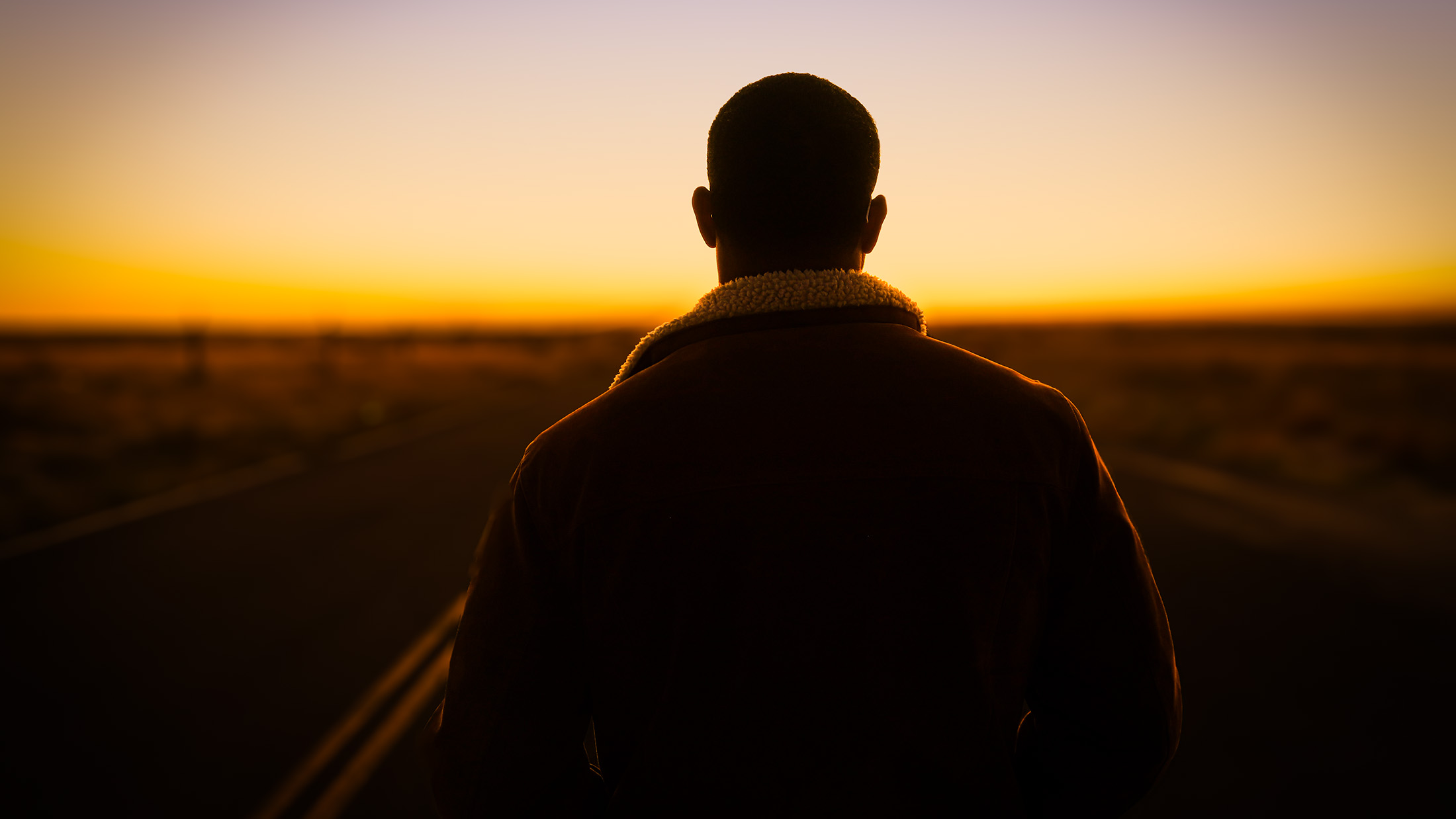 Article image - man looking out on road