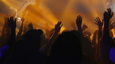 People worshiping in a crowd